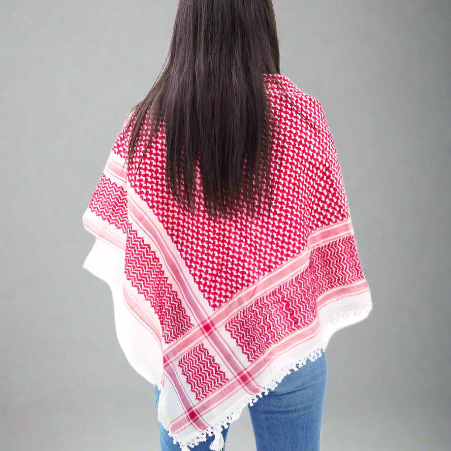 Woman wearing a red and white checkered Palestine scarf